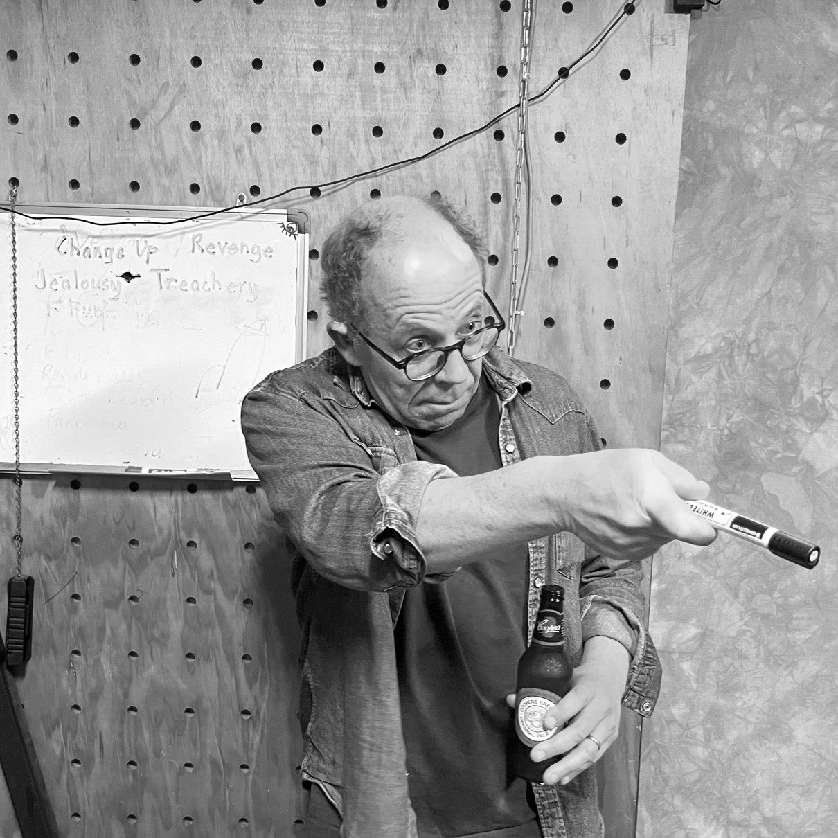 Pete pointing beside a whiteboard during a Pragmatics leadership discussion